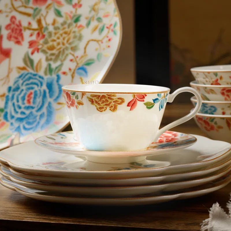 Tea cup placed on four stacked saucers.