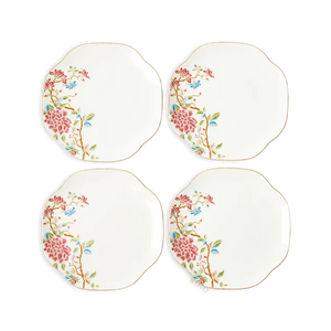 Set of 4 floral chinoiserie bone china square dinner plates on white background.