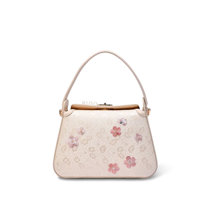 Embroidered silk handbag with ice-cracked plum blossom design.