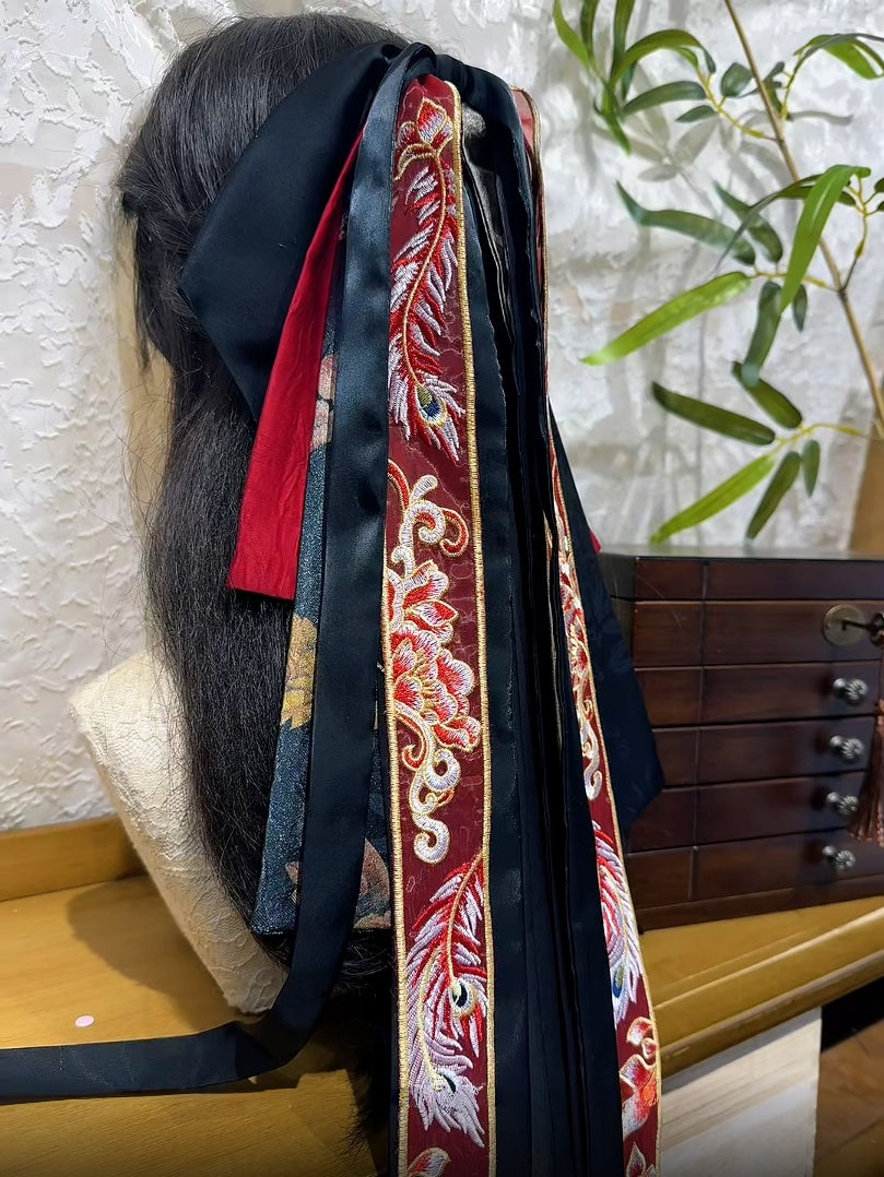 Front view of Feng Qiu Huang new Chinese hair bow with dramatic layered ribbon tails