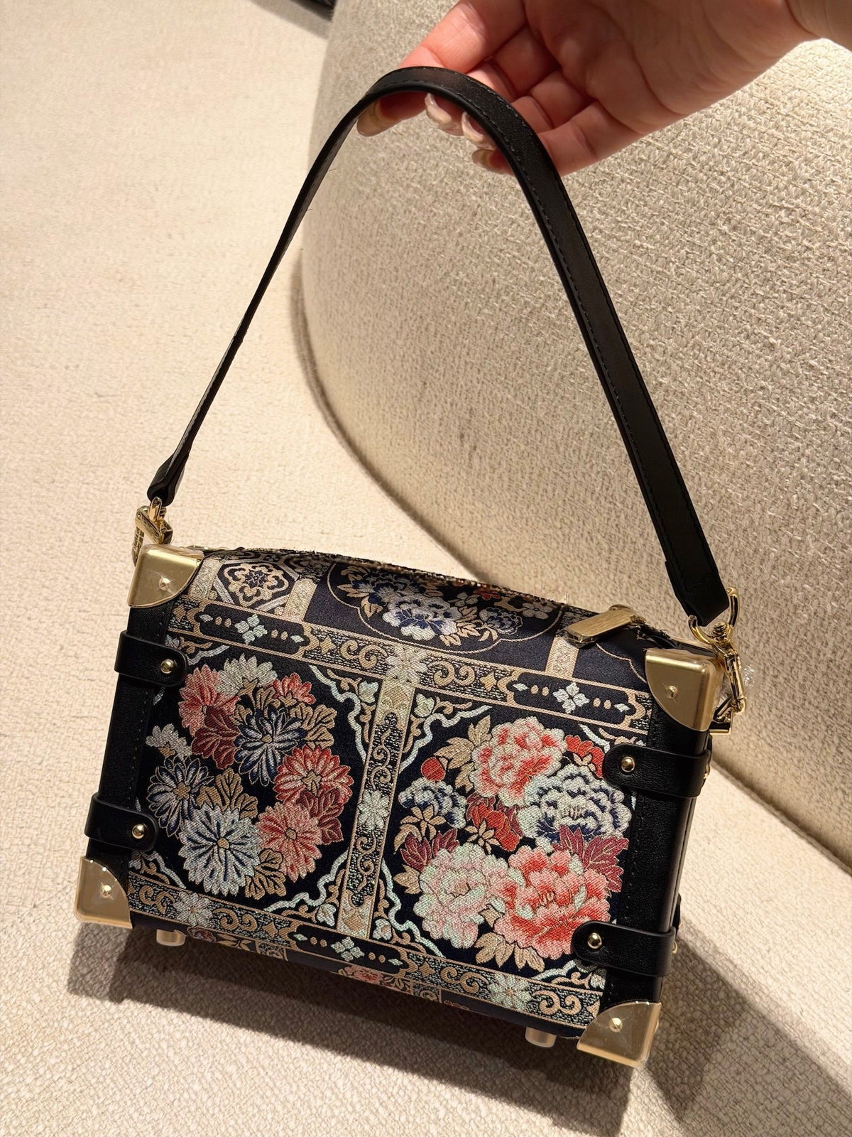 Gift-ready Song brocade clutch bag with heritage-inspired design for meaningful luxury gifting lifestyle angle