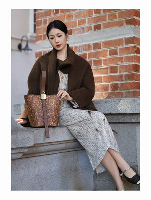 Bucket bag view showing compact structure, carry options, and daily essentials capacity featuring Dunhuang Scroll Grass
