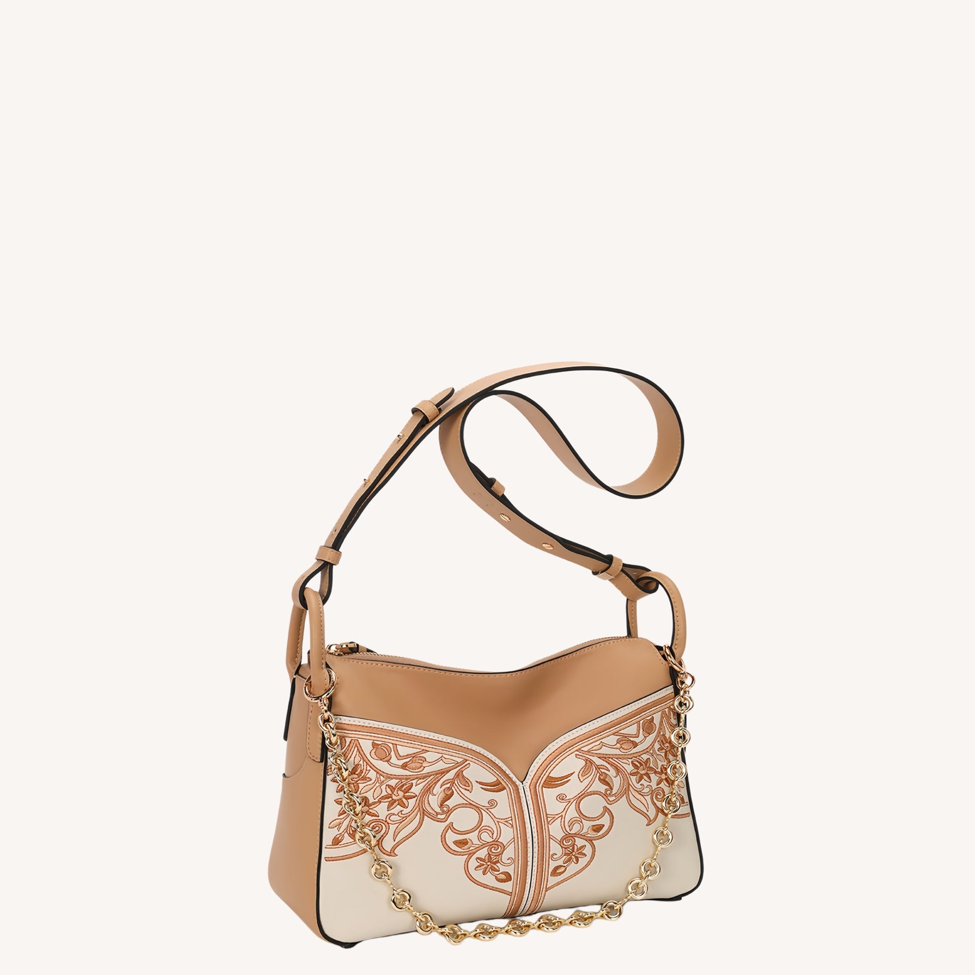 Close view of embroidered crossbody bag showing floral texture and refined leather finish featuring Embroidered-brocademodern