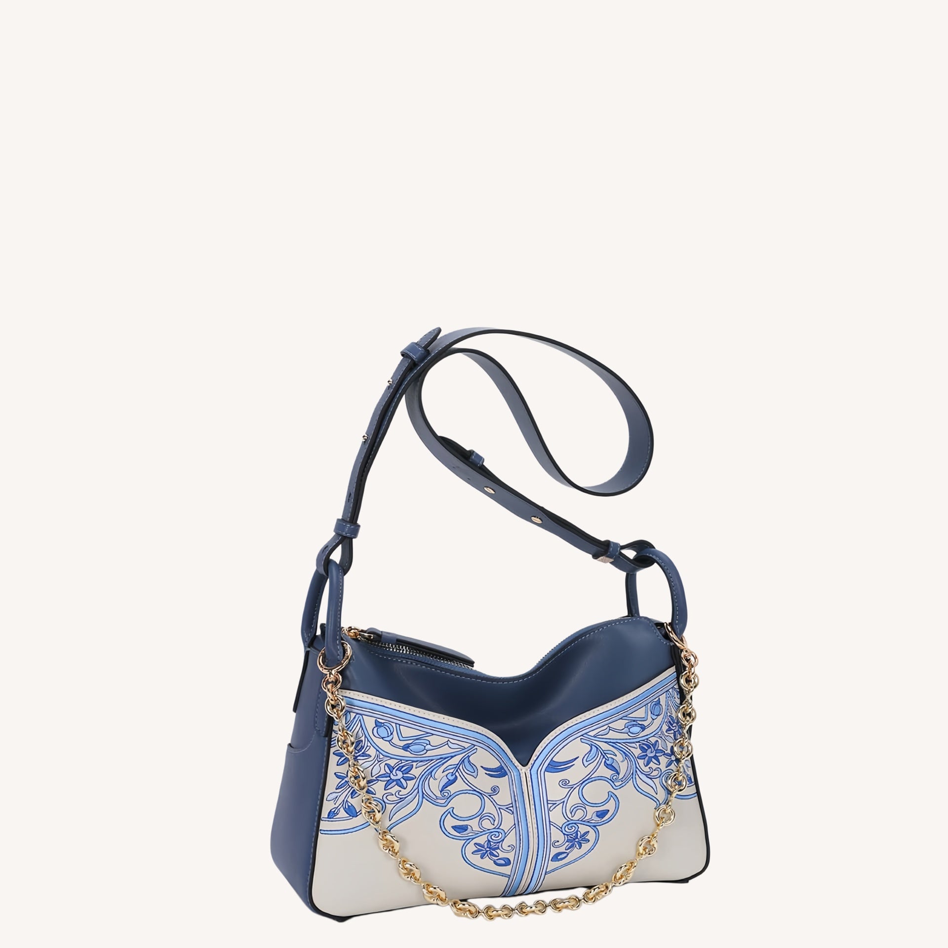 Close view of embroidered crossbody bag showing floral texture and refined leather finish featuring Embroidered-brocademodern