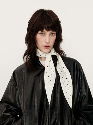 Mulberry silk scarf styled as wearable art with graceful drape and Chinese-inspired detail featuring 100 Mulberry Silk Neck