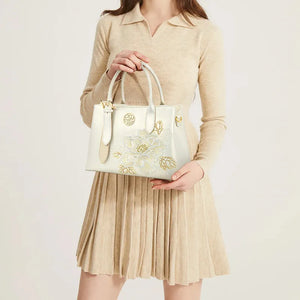 Model holding Embroidery Leather Tote Bag with White Blooming Peony.