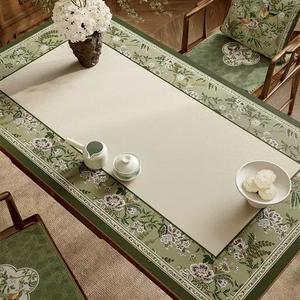 Right detail of floral leather table mat with dining set.