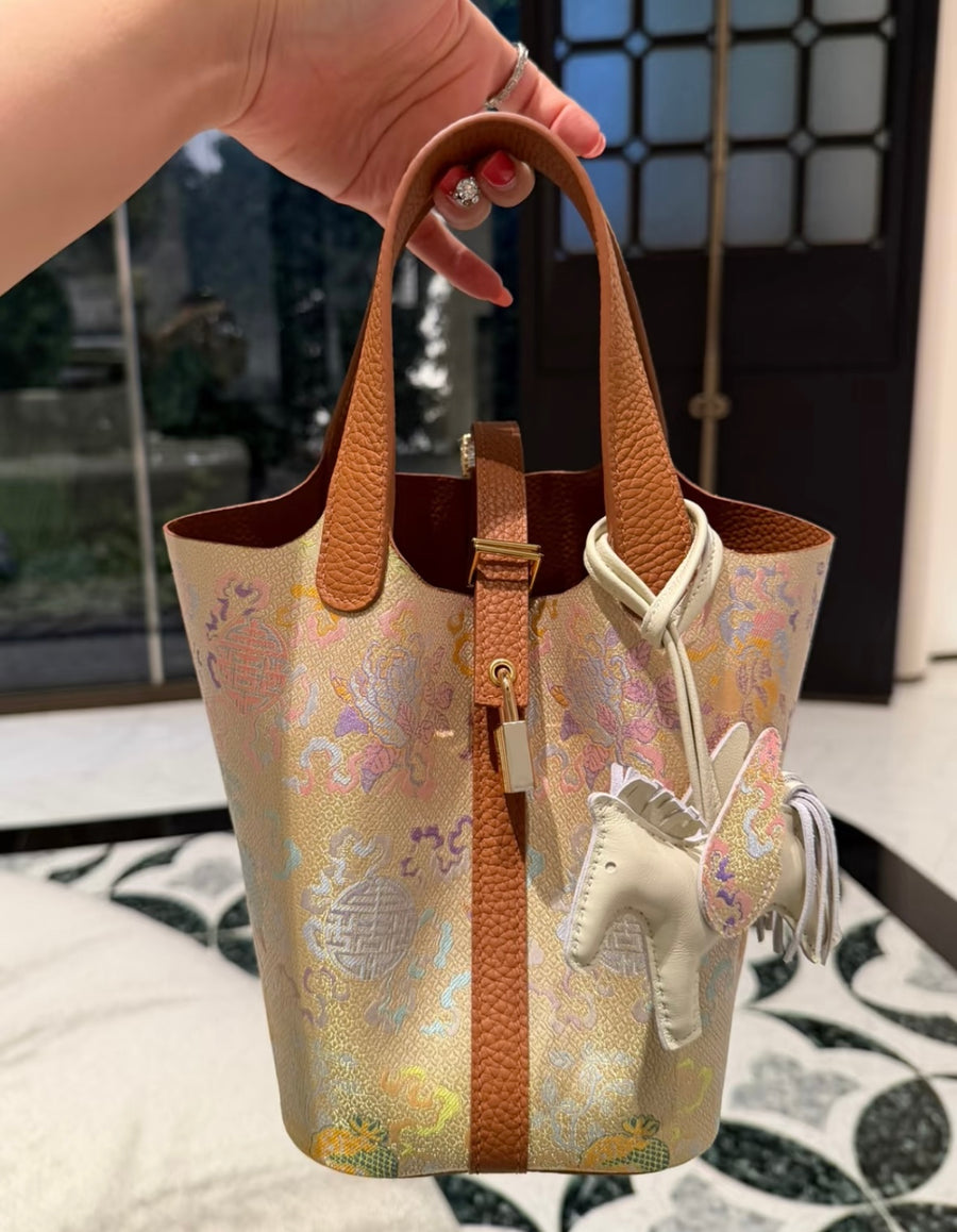 Gold Ancient Coins Three Blessings Chinese Song Brocade handbag with warm golden tones, symbolic coin motifs, and tan leather handles brocademodern