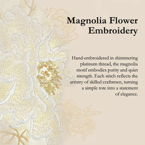 Magnolia flower embroidery detail: hand-stitched with shimmering platinum thread, symbolizing purity and quiet strength.