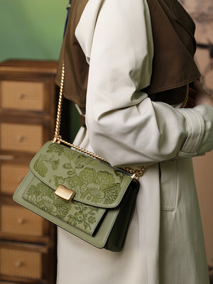 Close view of embroidered crossbody bag showing floral texture and refined leather finish featuring Chinese Style Begonia-brocademodern