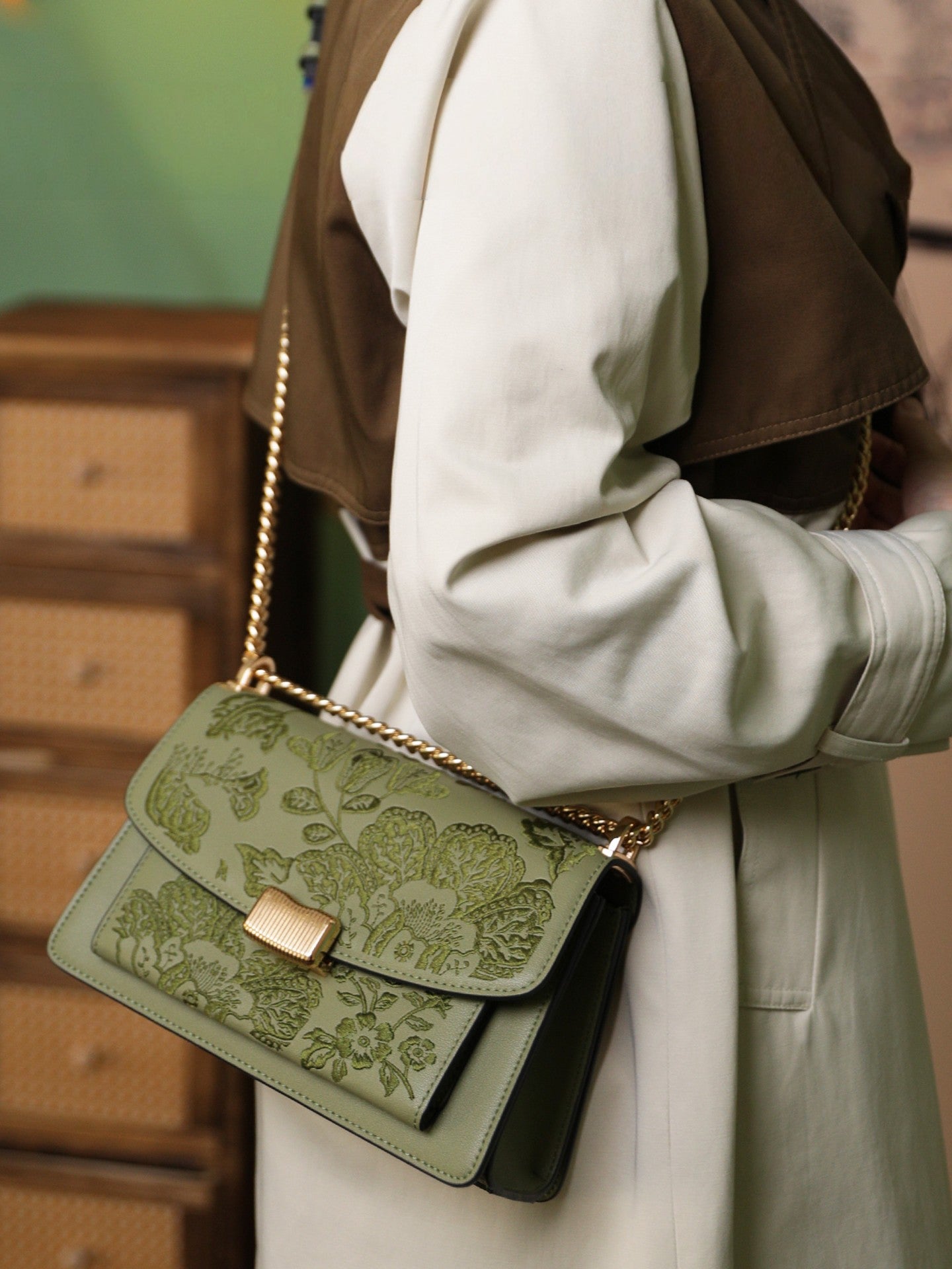 Close view of embroidered crossbody bag showing floral texture and refined leather finish featuring Chinese Style Begonia-brocademodern