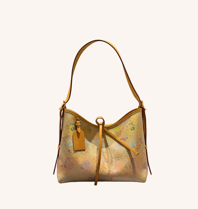 Song brocade tote bag with ancient coin motif and structured elegant handbag silhouette