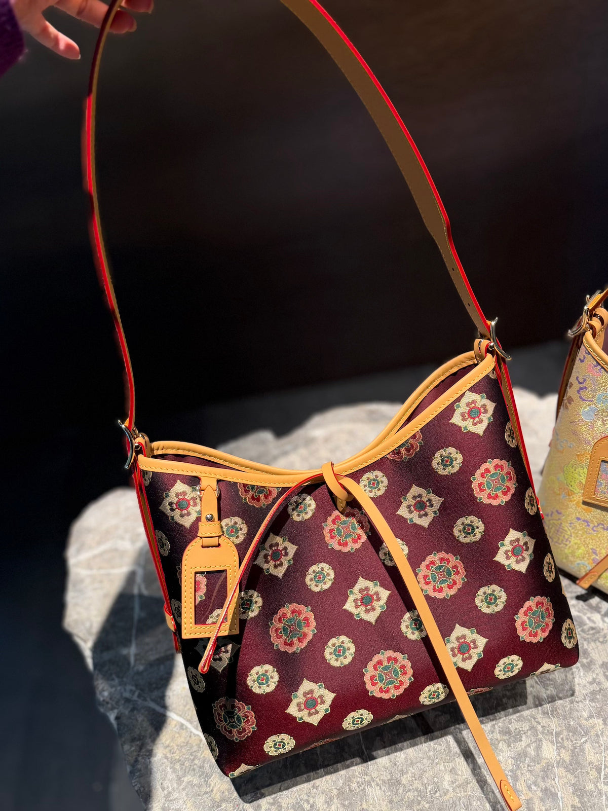 Close view of Song brocade tote bag showing woven motif texture and refined finish featuring Large Tote Shoulder Bag