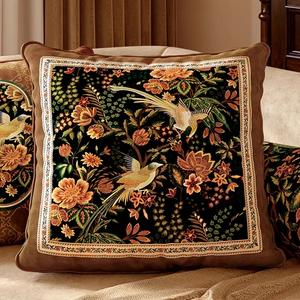 Close-up of luxury chinoiserie magpie blossoms pillow on sofa.