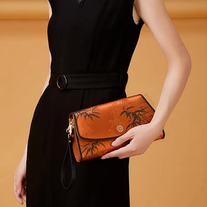 Chinoiserie Vintage Brown Bamboo Clutch on Minimalist Display Stand.